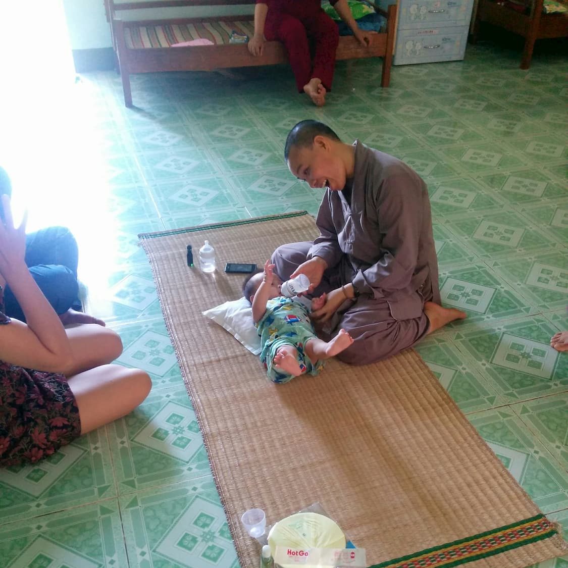 Monk Feeding baby